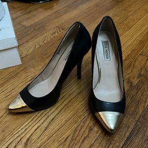 Black heels with metallic toe.